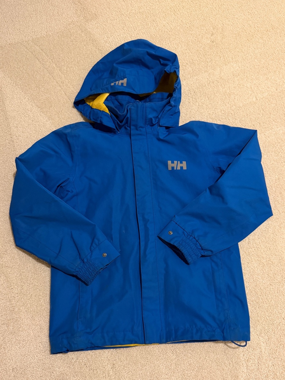 Helly Hansen Kids Blue Rain Jacket with Hood and zipped pockets